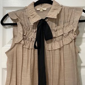 Tan top with black bow